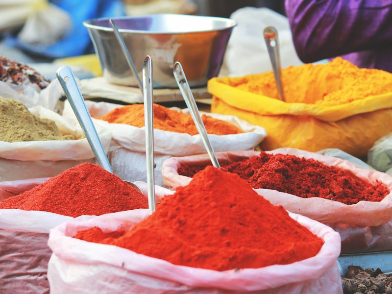 Heaps of red chilli powder and turmeric