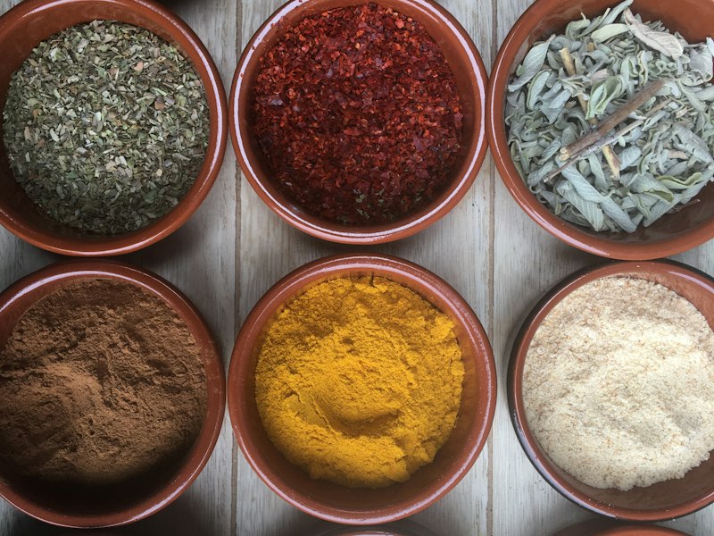 Bowls of whole and ground spices